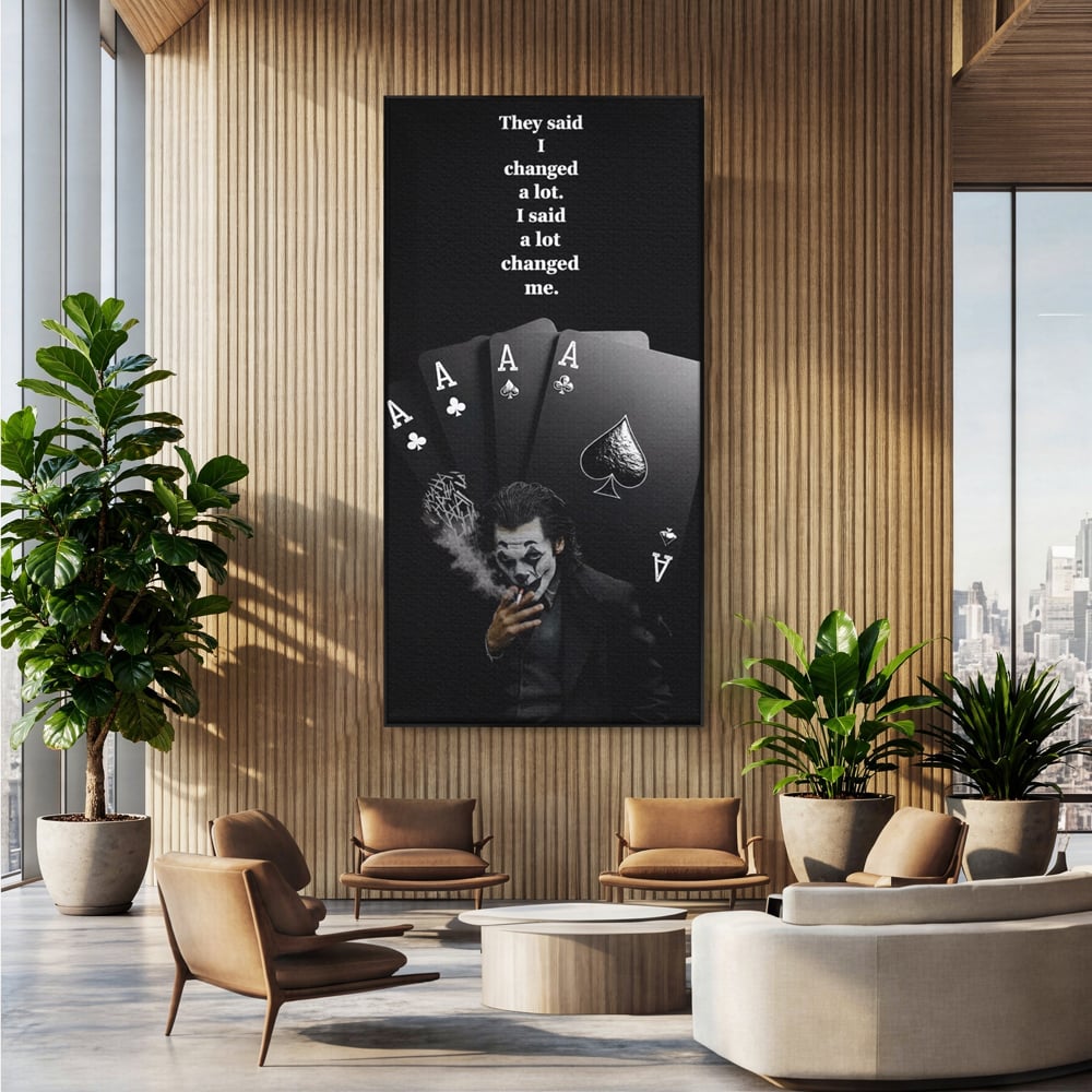 Tablou canvas cu tablou motivational cu joker si carti de joc, in rama de aluminiu negru, pe perete intr-un birou